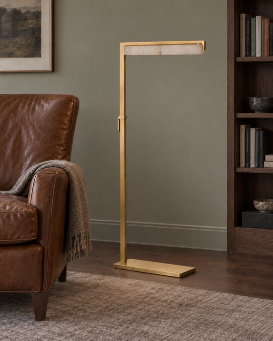Linea brushed brass floor lamp — AI-generated illustrative study — light off; lighting appearance is illustrative