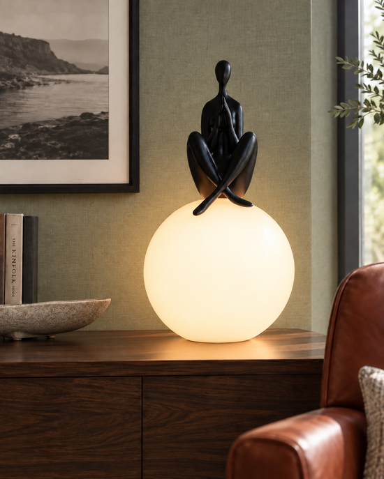 Soleno Meditation Sculptural Table Lamp — light on; AI-generated interior scene; Black